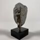Sculpture of a Buddha head in grey schist from Gandhara, ancient Greece.