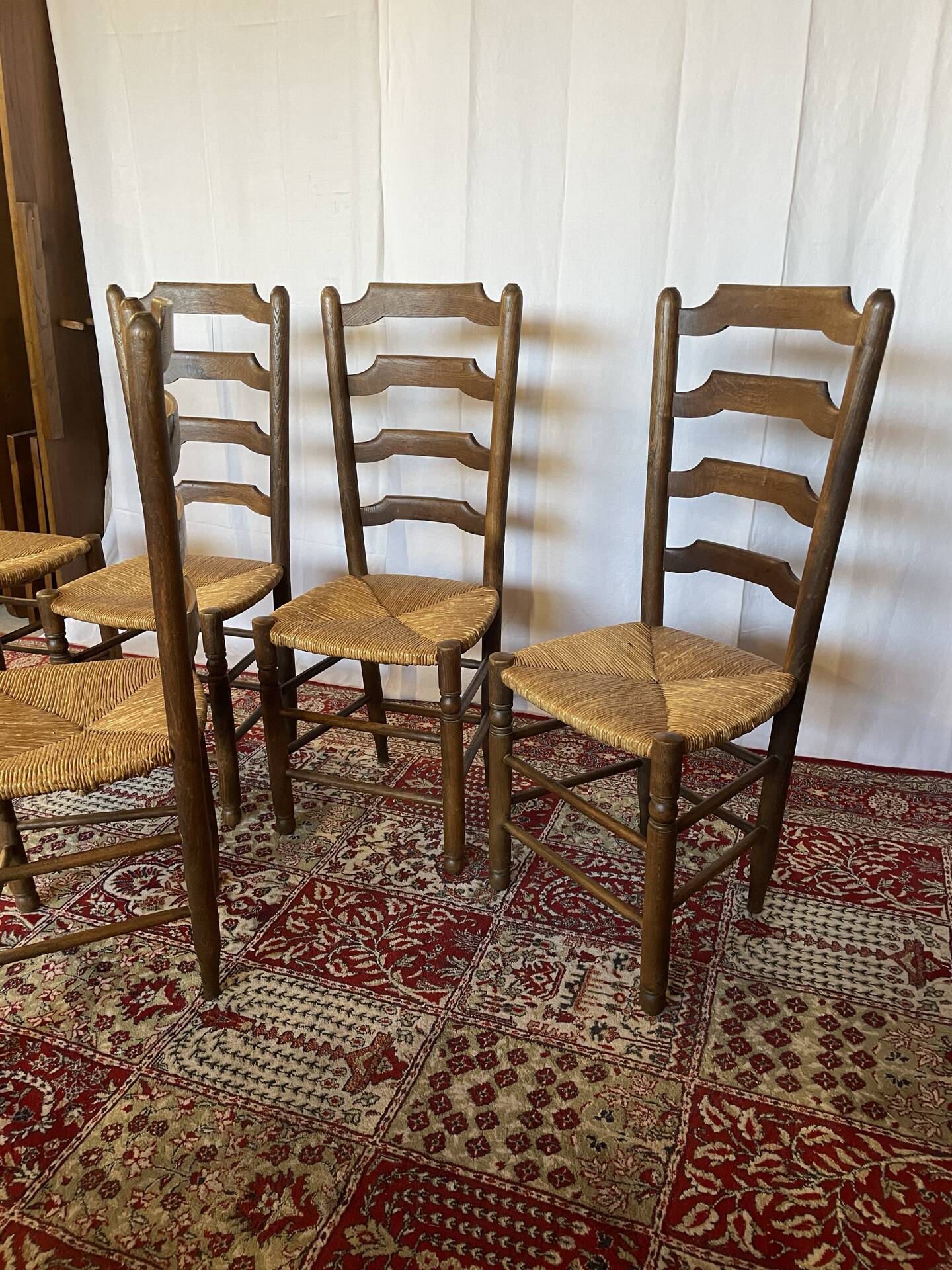 Set of 5 antique oak and straw chairs.