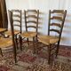 Set of 5 antique oak and straw chairs.