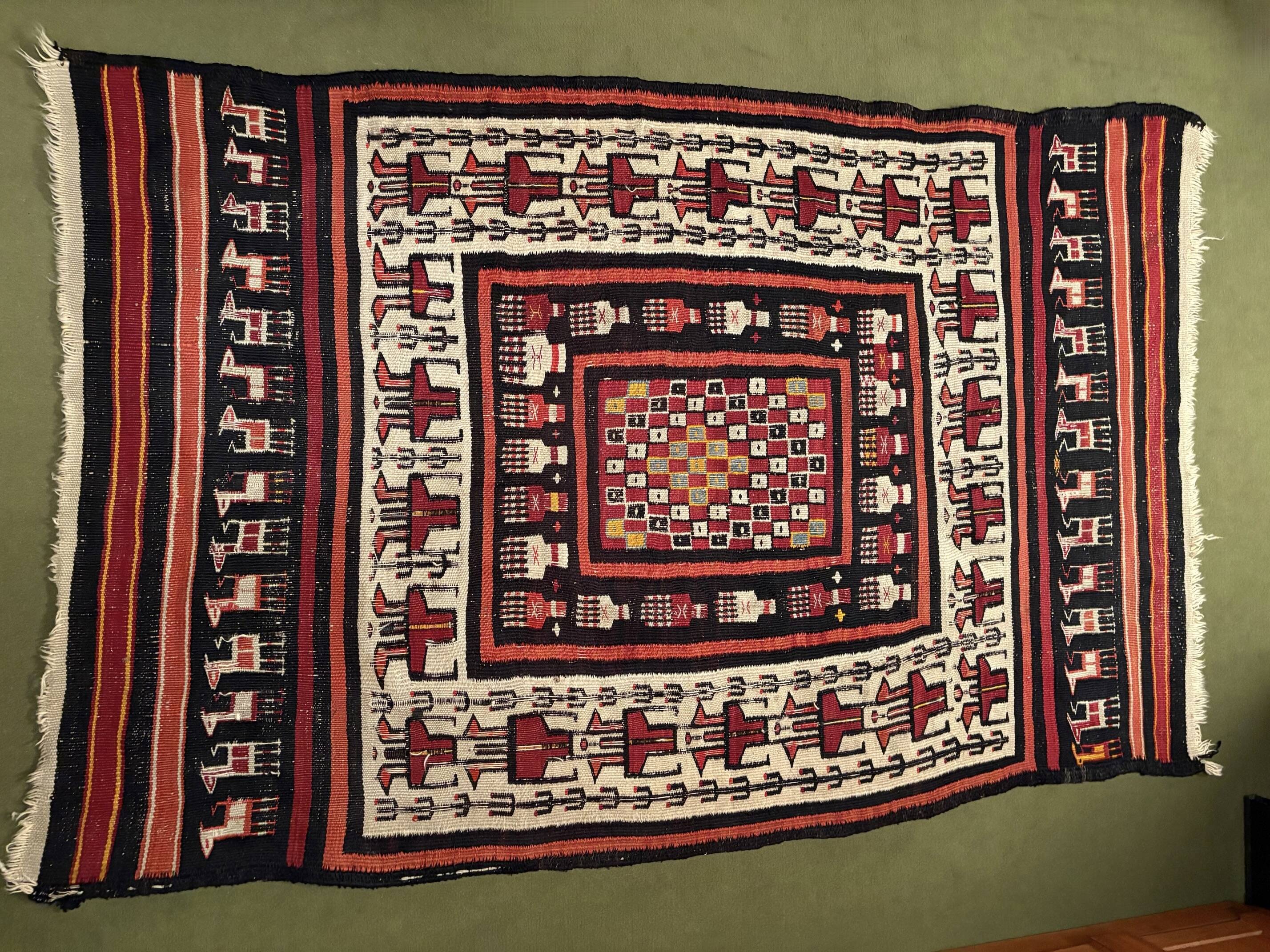 Rectangular folk rug from North Africa with a dominant red colour, 1970s.