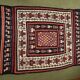 Rectangular folk rug from North Africa with a dominant red colour, 1970s.