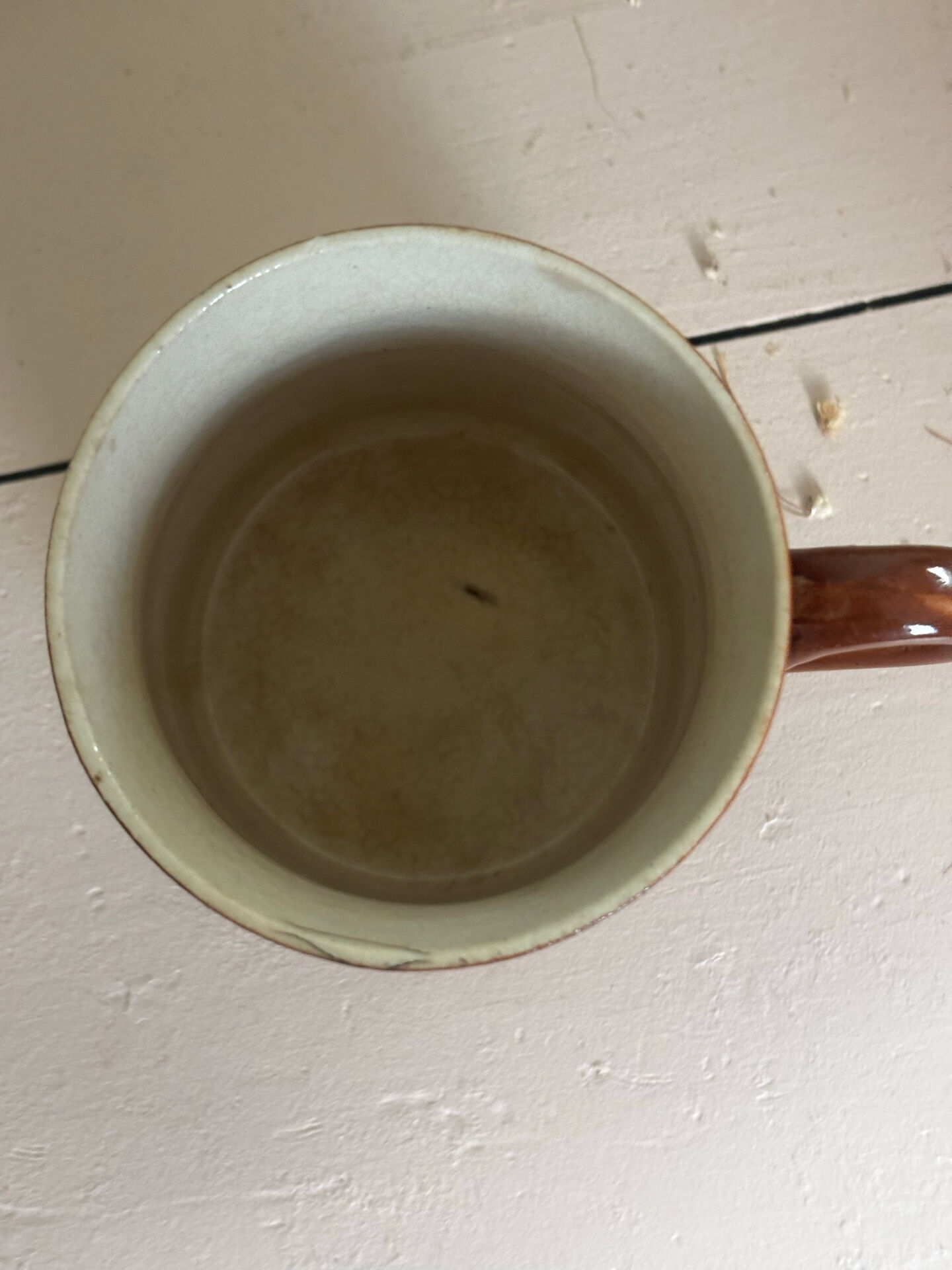 Vintage 70s old ceramic mug with a brown cubic graphic pattern.
