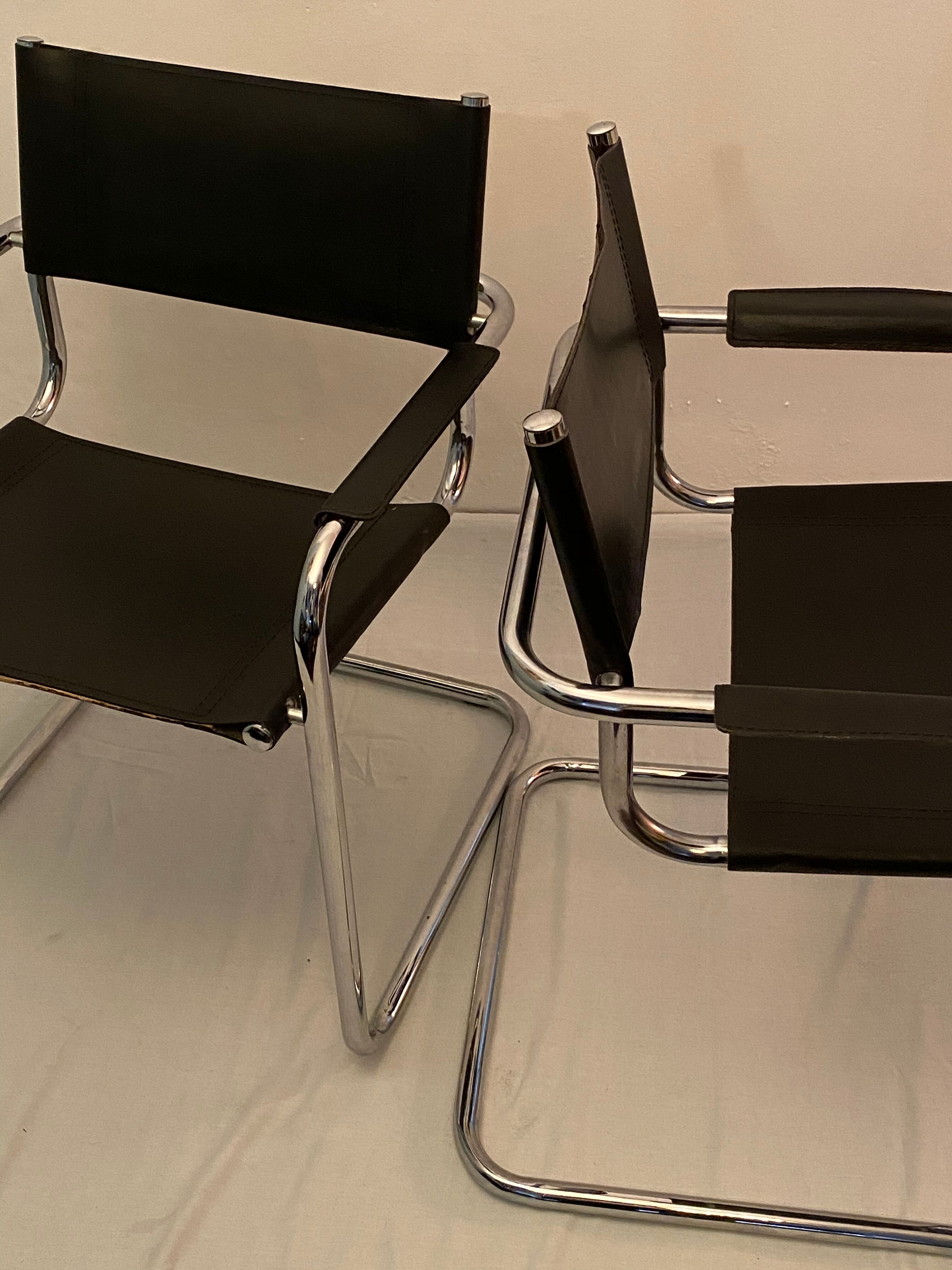 Pair of chrome and leather tube chairs
