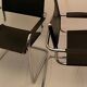 Pair of chrome and leather tube chairs