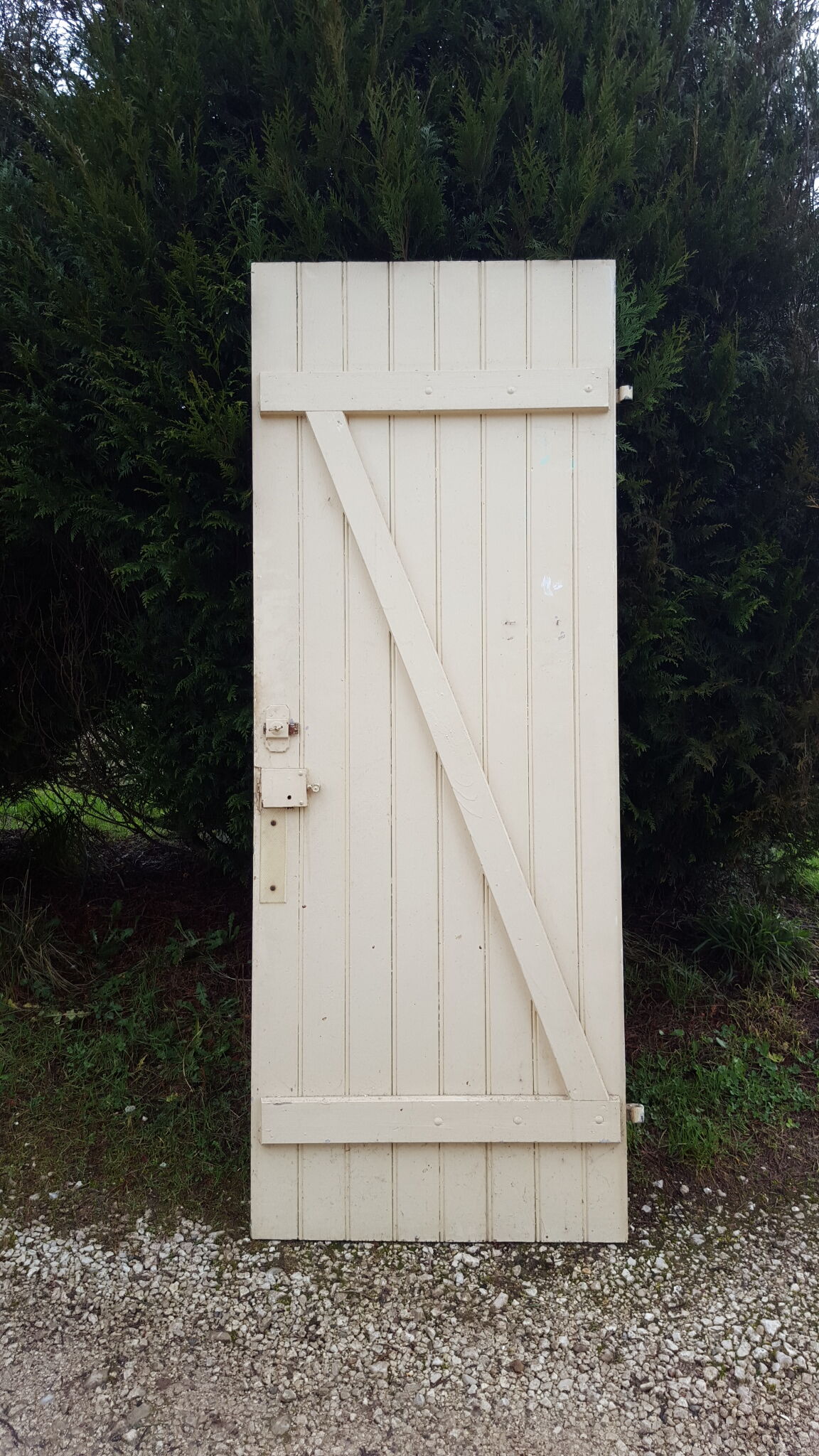 Old door in cream lacquered wood