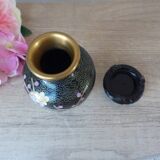 Small black cloisonné vase decorated with yellow and pink cherry blossoms, vase on wooden base