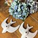 Pair of plaster swallows
