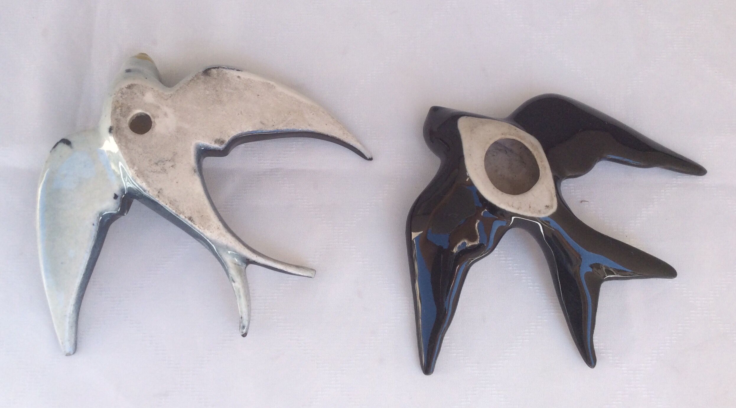 Two ceramic wall swallows