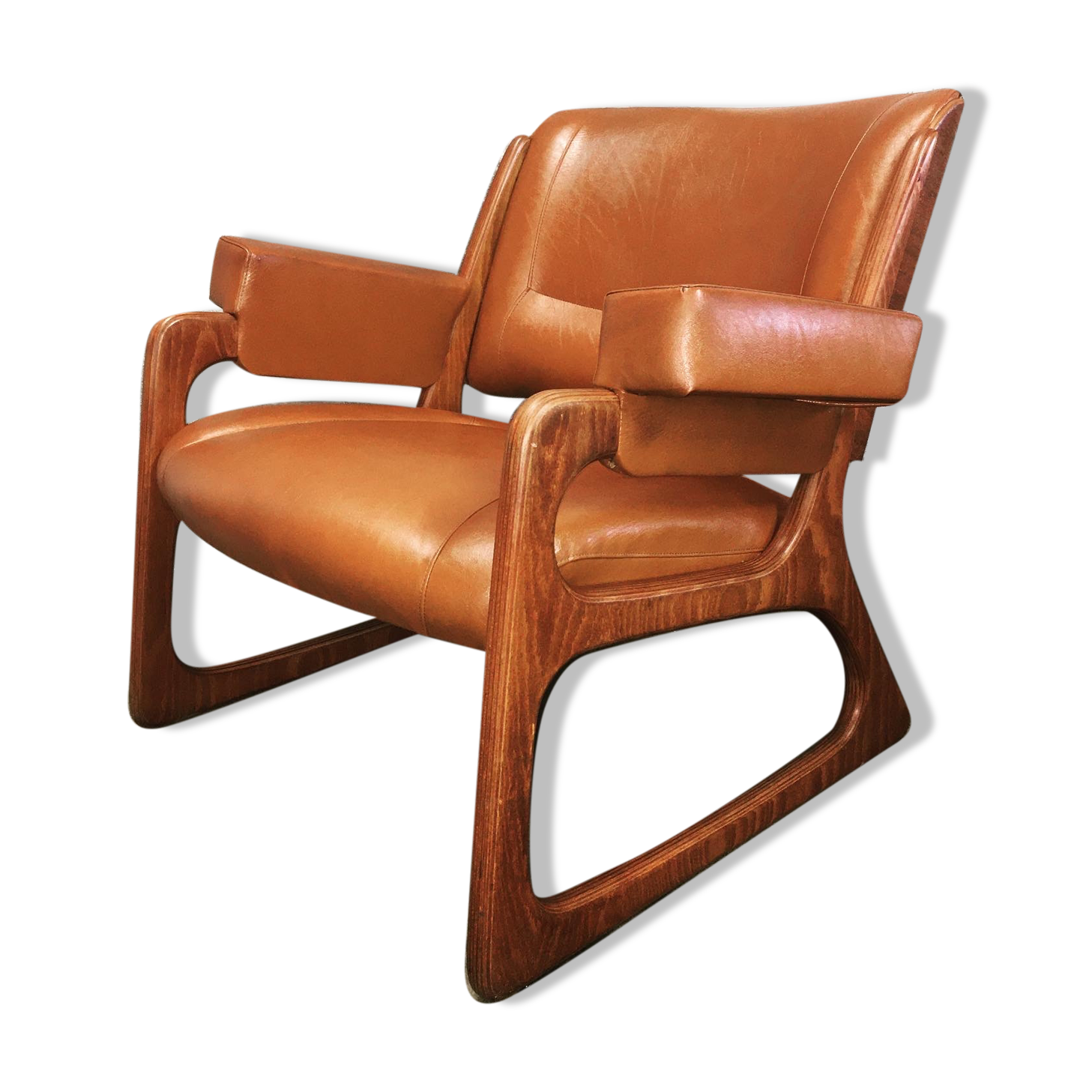 Armchair called "sled" Publisher Baumann and Ottoman