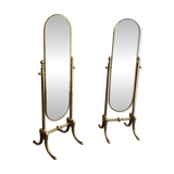 Pair of brass cheval mirrors in neoclassical style
