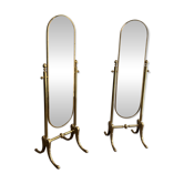 Pair of brass cheval mirrors in neoclassical style