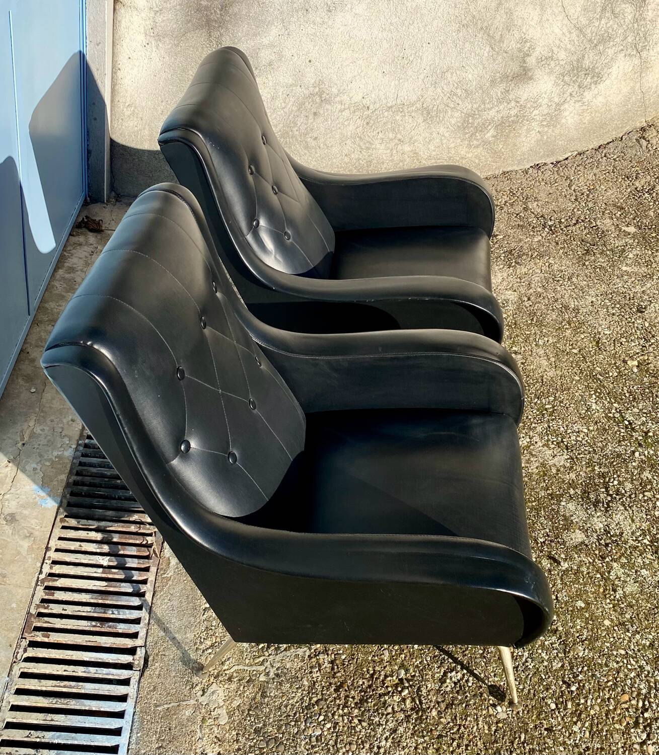 2 vintage faux leather armchairs