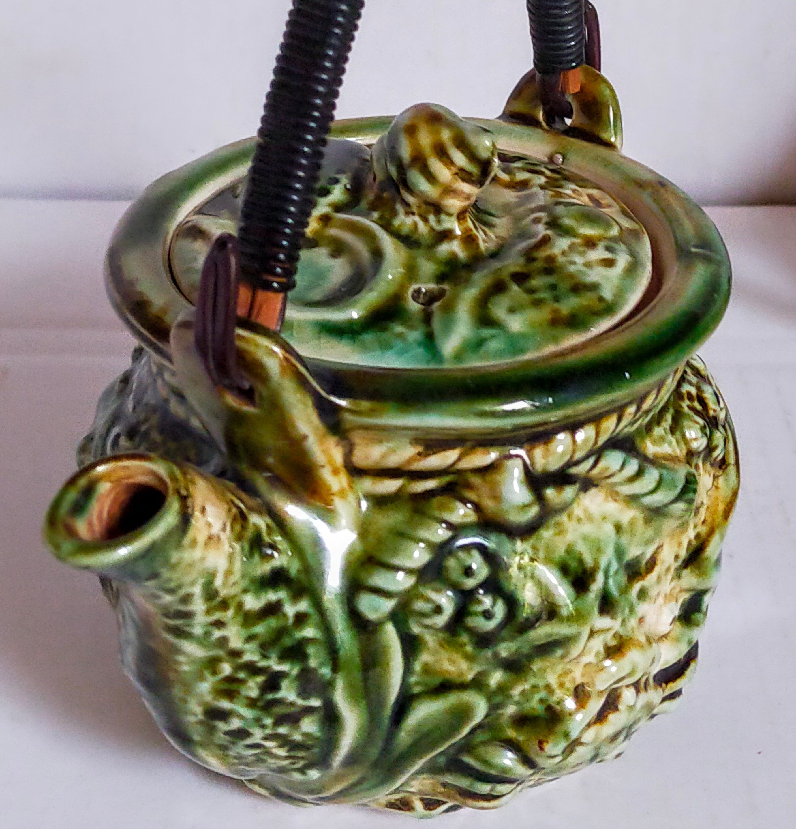 Set of old teapots and honey pot