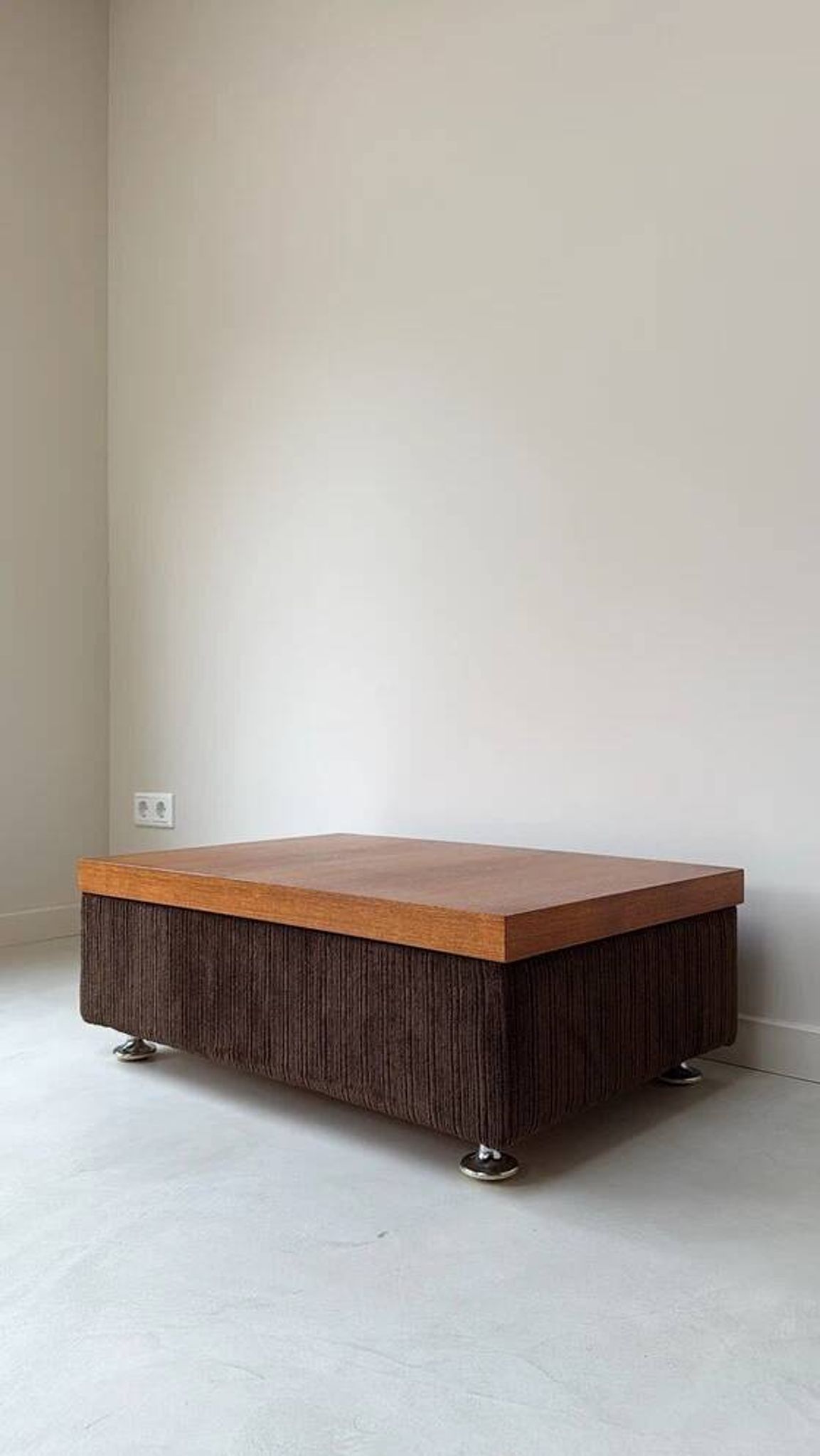 Coffee table with brown corduroy fabric, wooden top and chrome legs