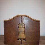 Old wooden key box cut out in the shape of a lock