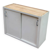 Vintage wall-mounted kitchen cabinet with sliding doors in 1960s retro style.