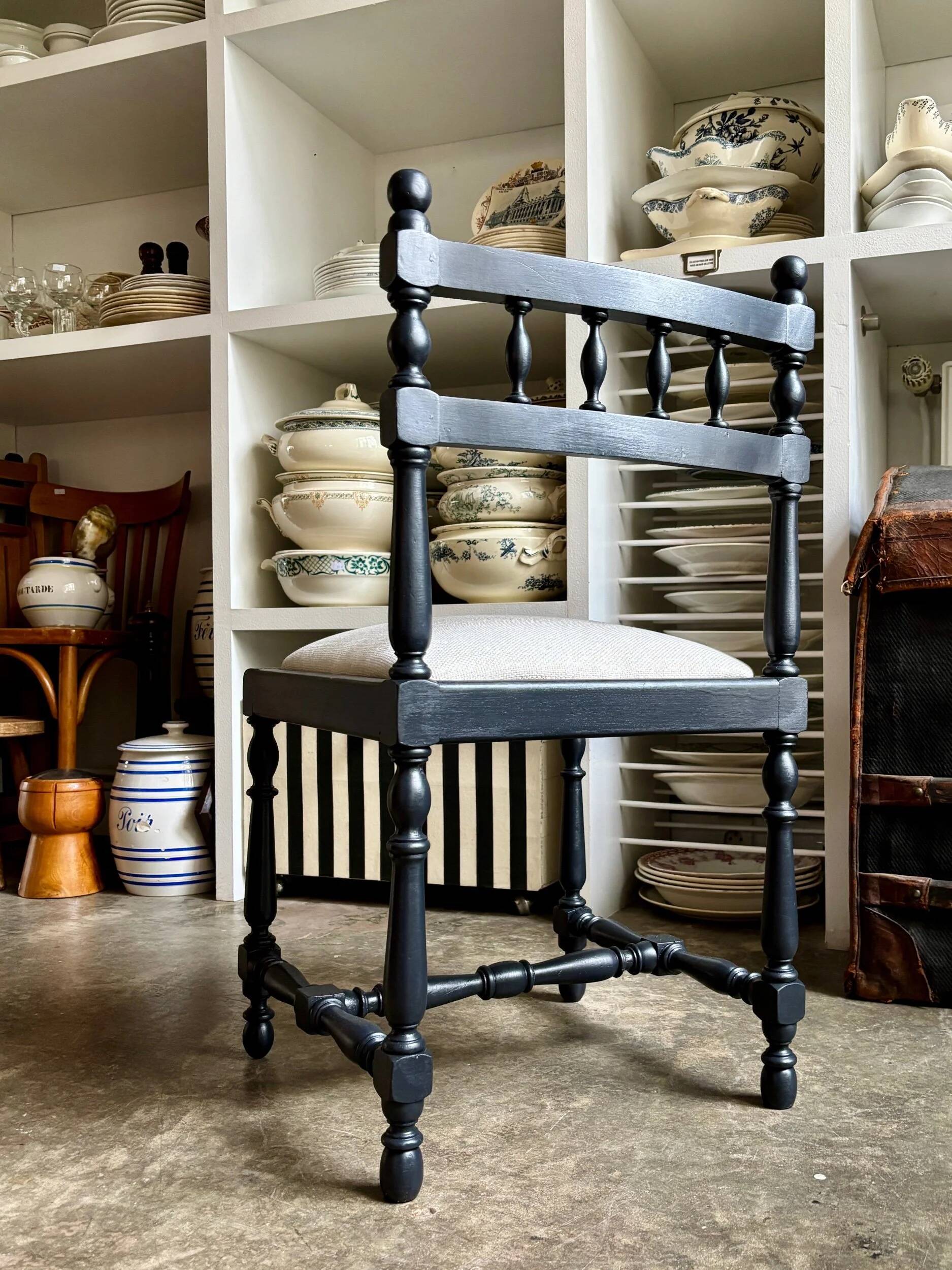 Black turned wooden chair and ivory cotton.