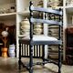 Black turned wooden chair and ivory cotton.