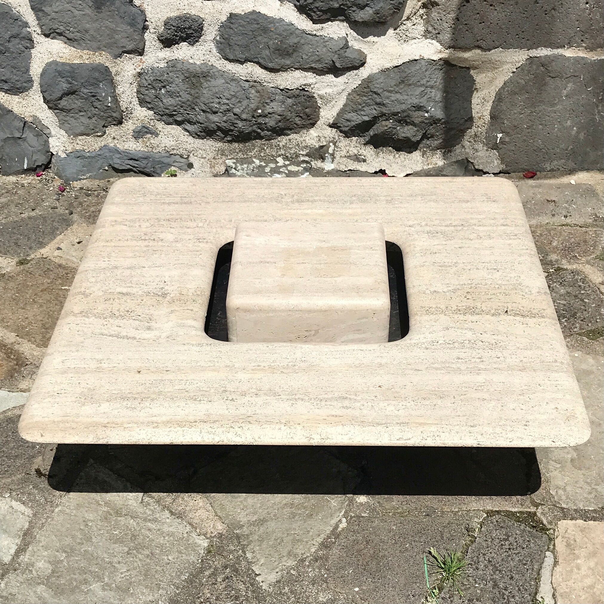 Sculptural travertine coffee table