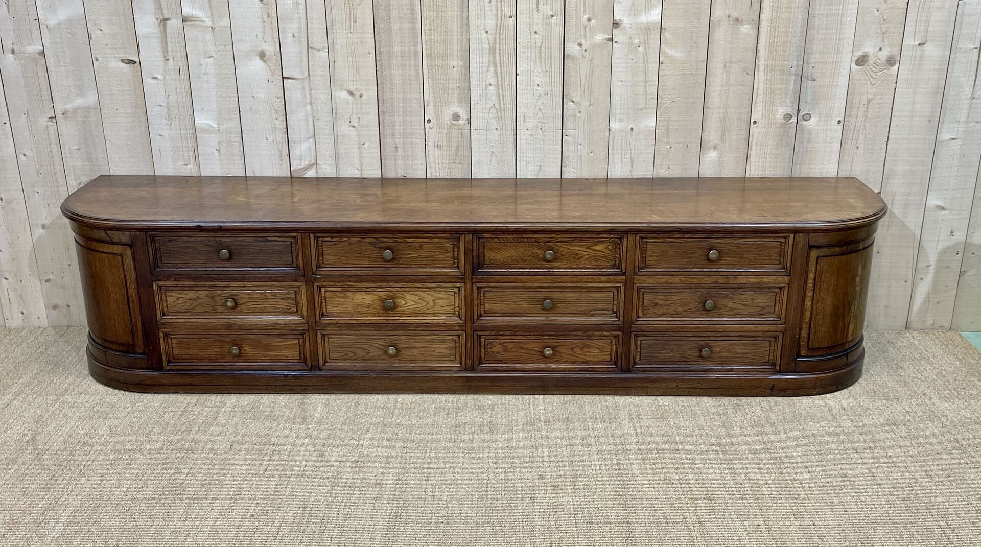 Long low oak countertop with 12 drawers - early XXth