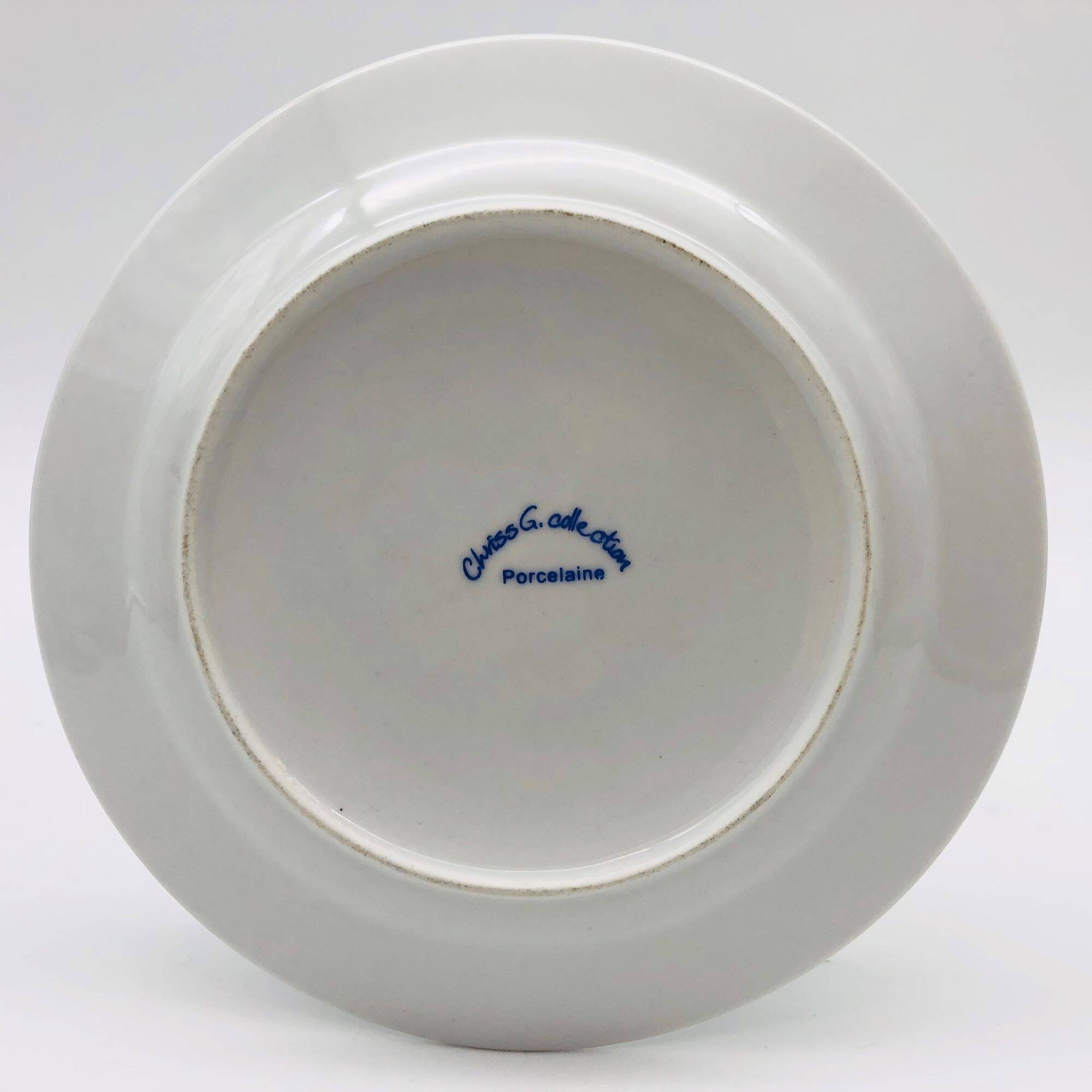 6 “Chriss G. Collection” porcelain dessert plates.