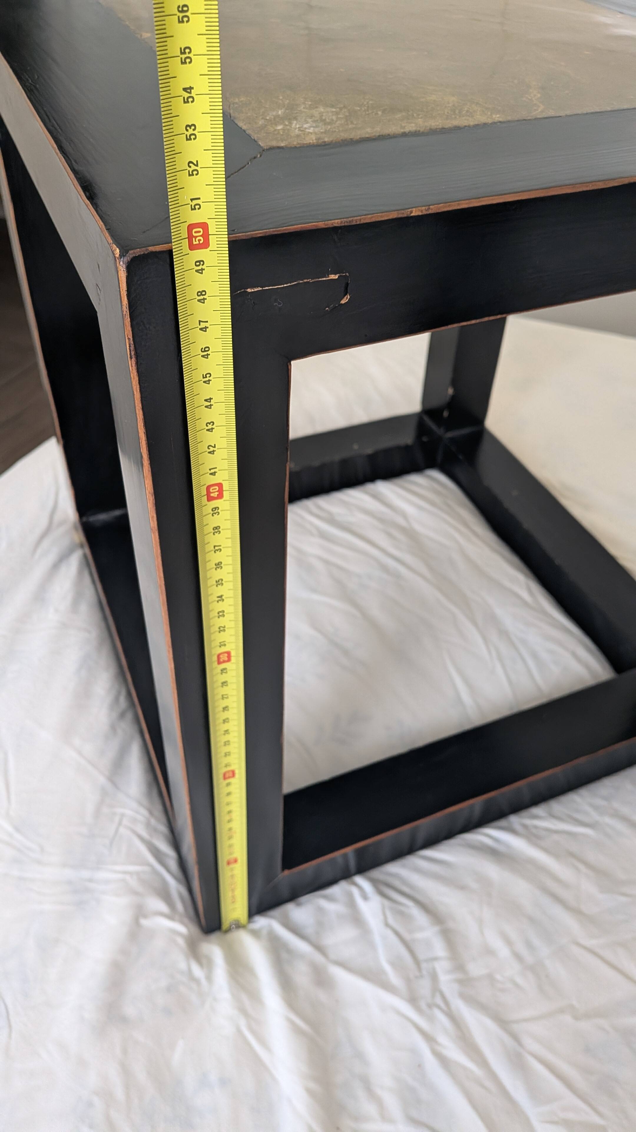 Chinese side tables in black lacquer, stone top.