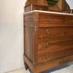 Antique carved wooden dressing table with marble and tilting oval mirror.