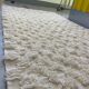 Ecru Berber rug with wool tufts and relief patterns – 250 × 152 cm