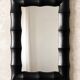 Rectangular mirror in patinated black wood resembling bamboo – 68 × 100 cm