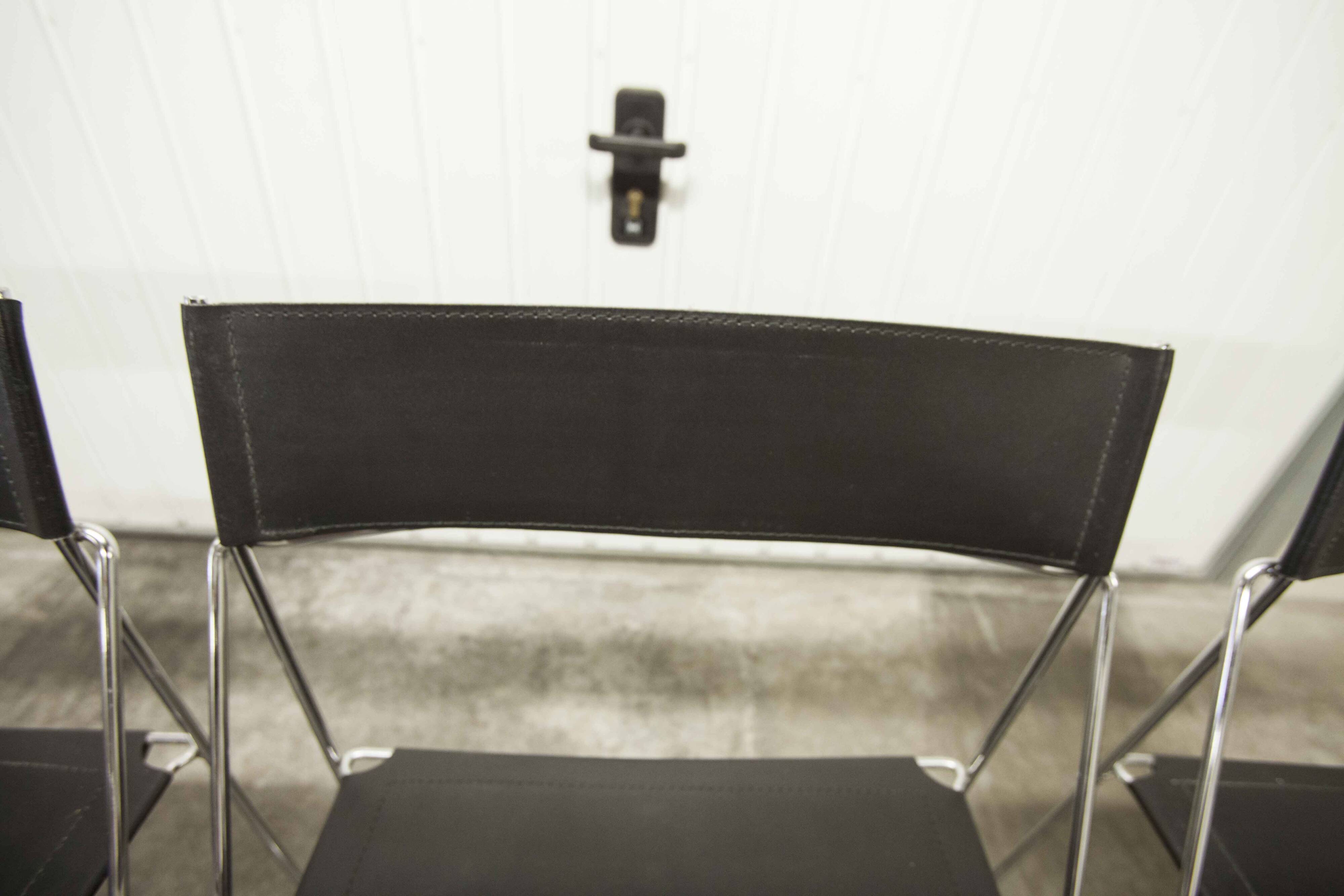 Set of 3 minimalist X line chairs by Niels Jorgen Haugesen.