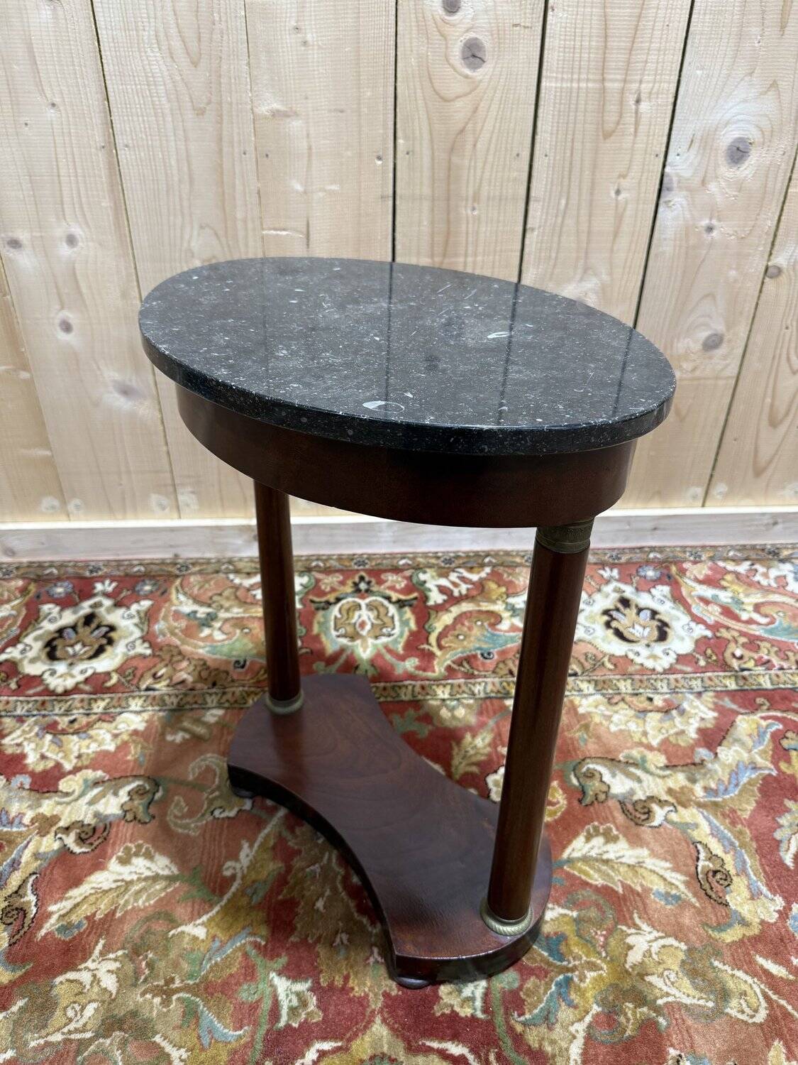 Small oval side table in Empire style
