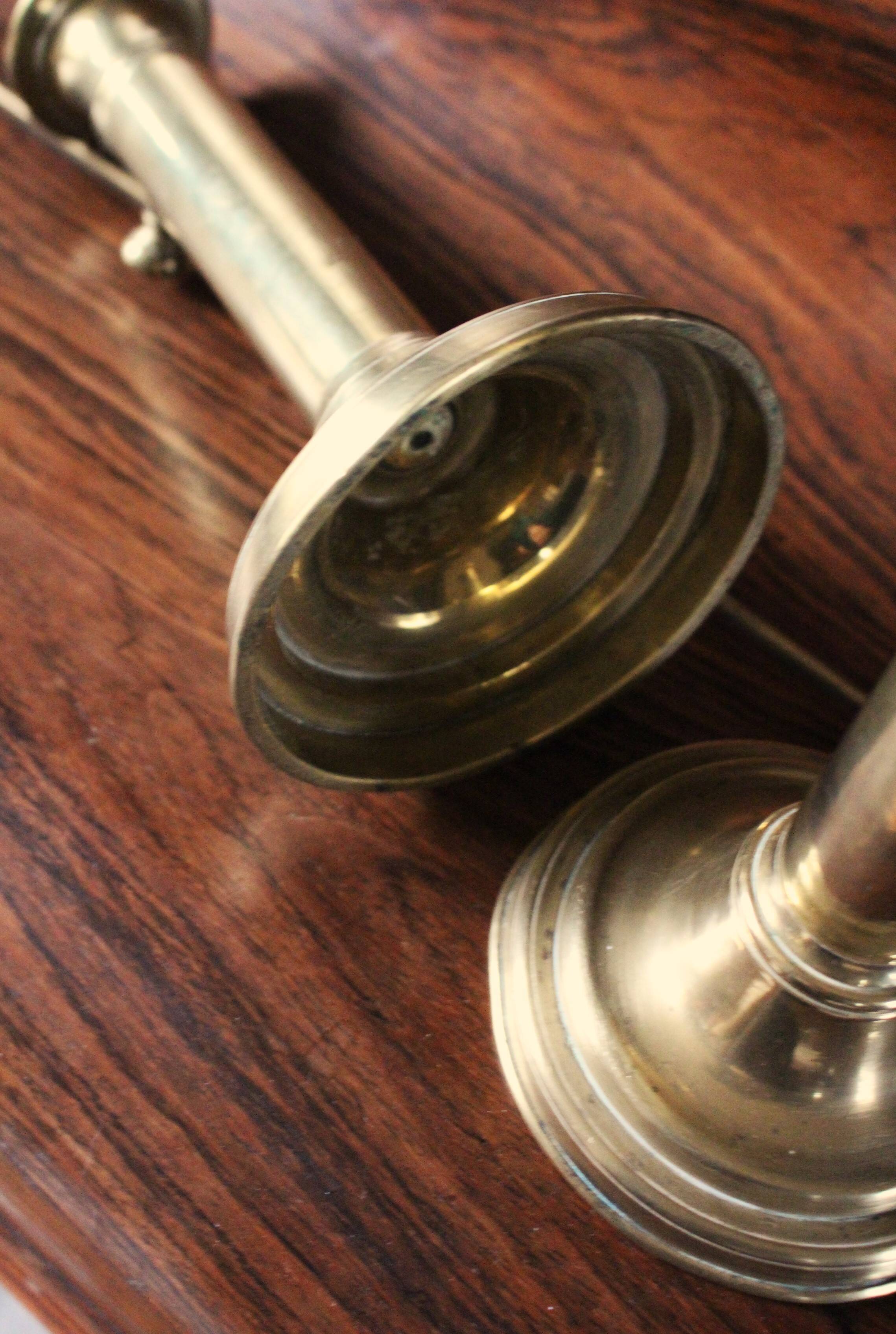 Pair of brass push-button candlesticks