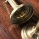 Pair of brass push-button candlesticks