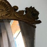 Antique wooden mirror with an unusual shape