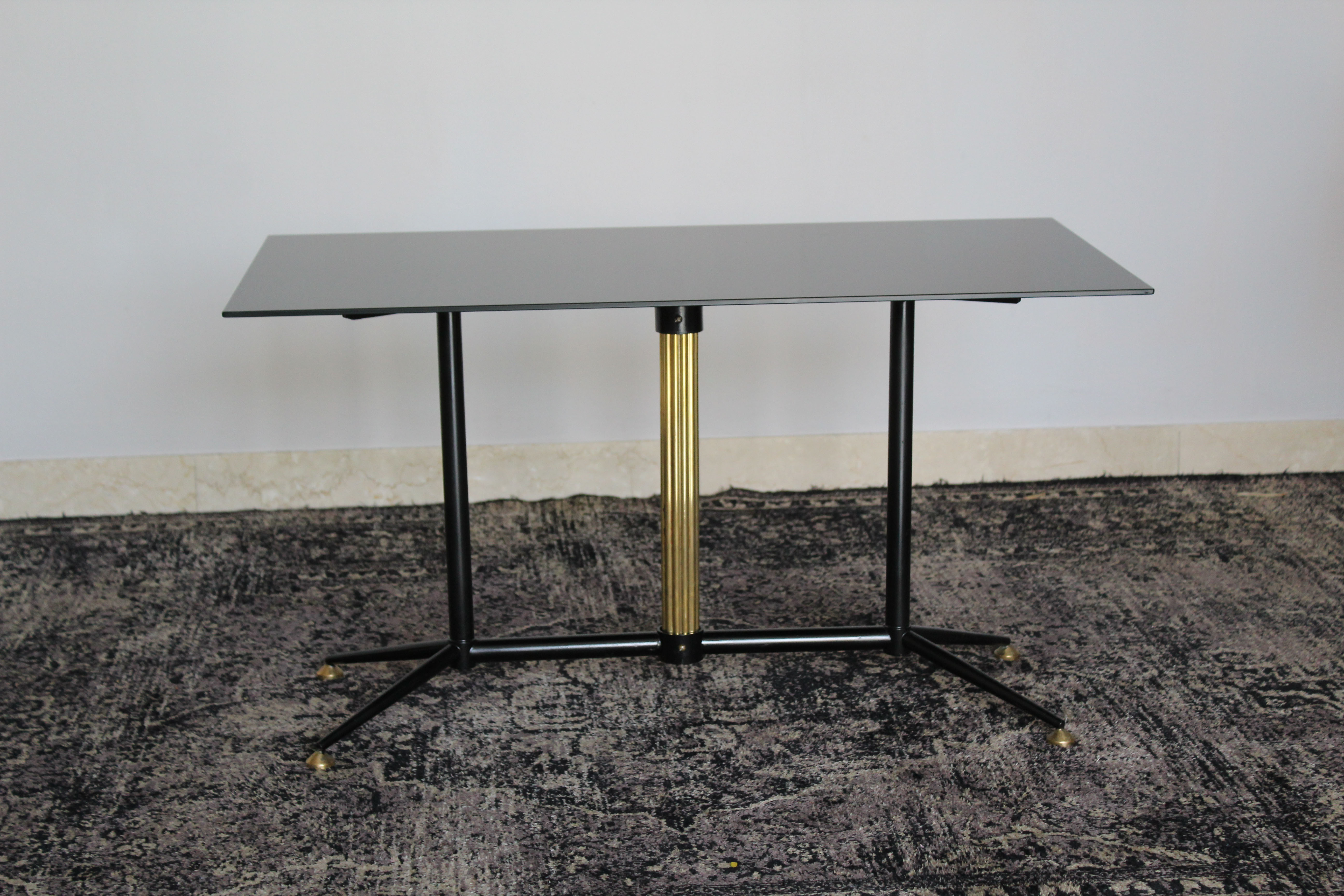 Coffee table in black glass lacquered brass and iron, Italy 50s