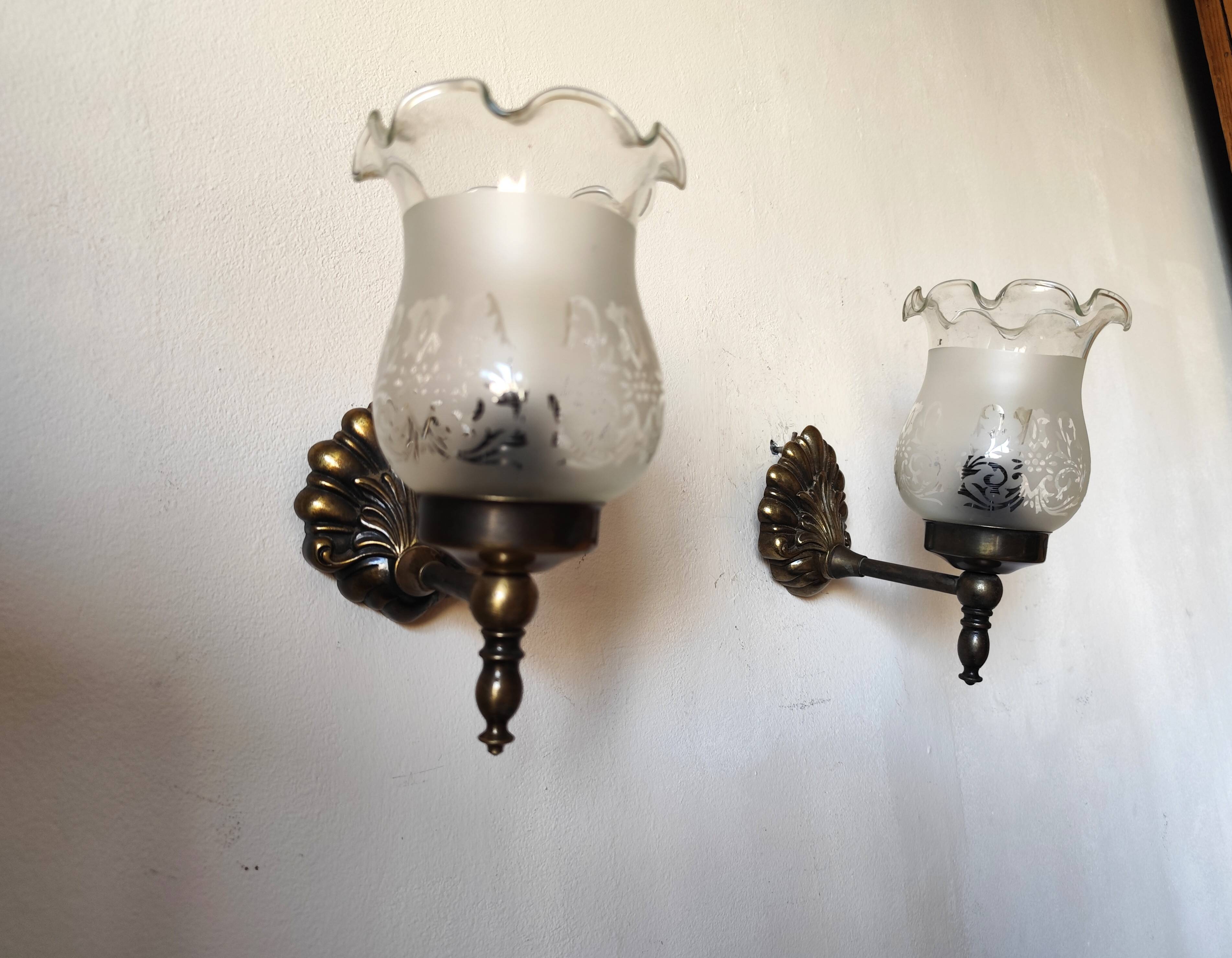Pair of wall sconces in bronze with opaline glass tulips.