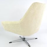 Cream corduroy swivel shell armchairs