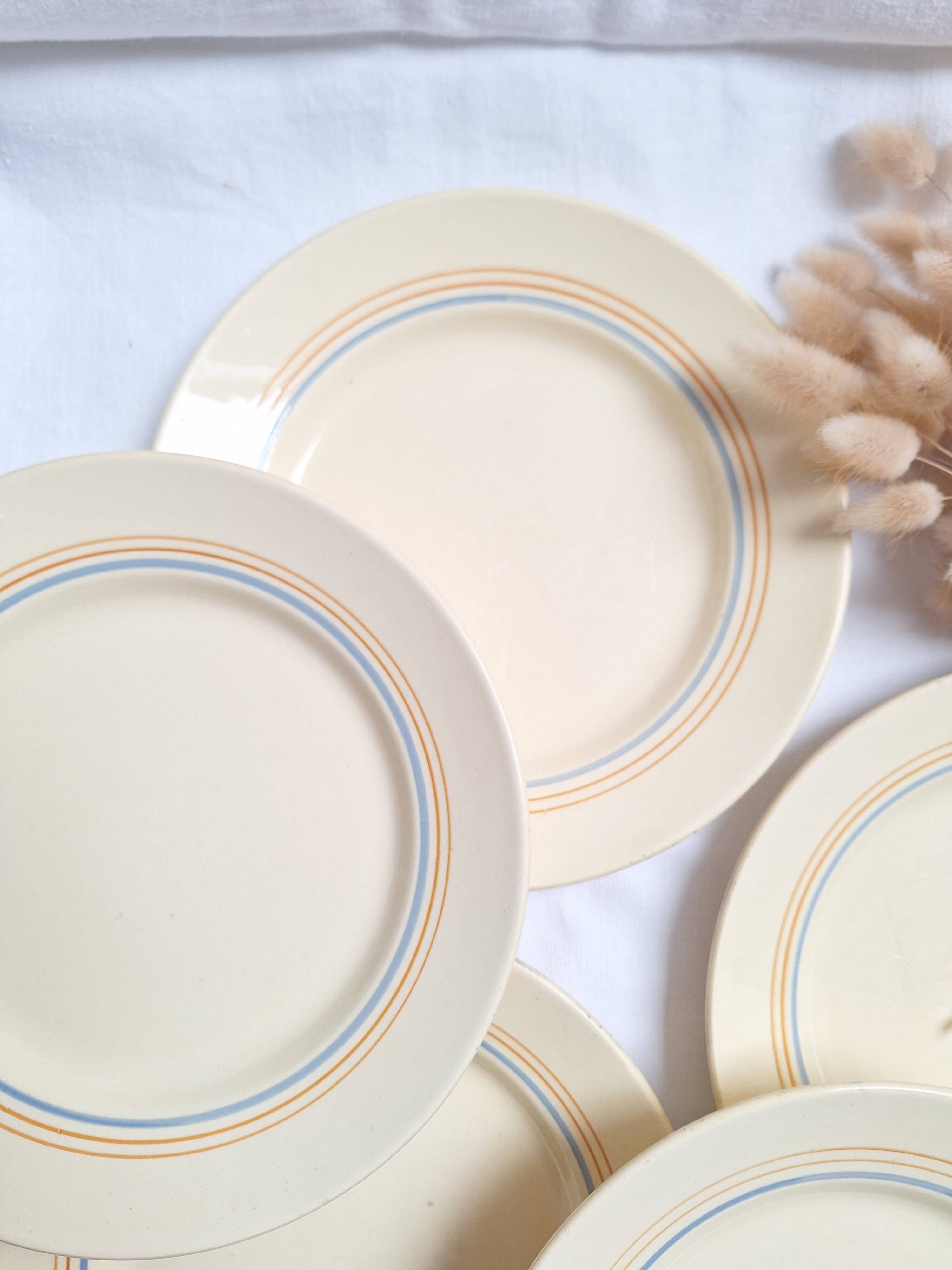 Vintage cream, orange and blue dinner plates.