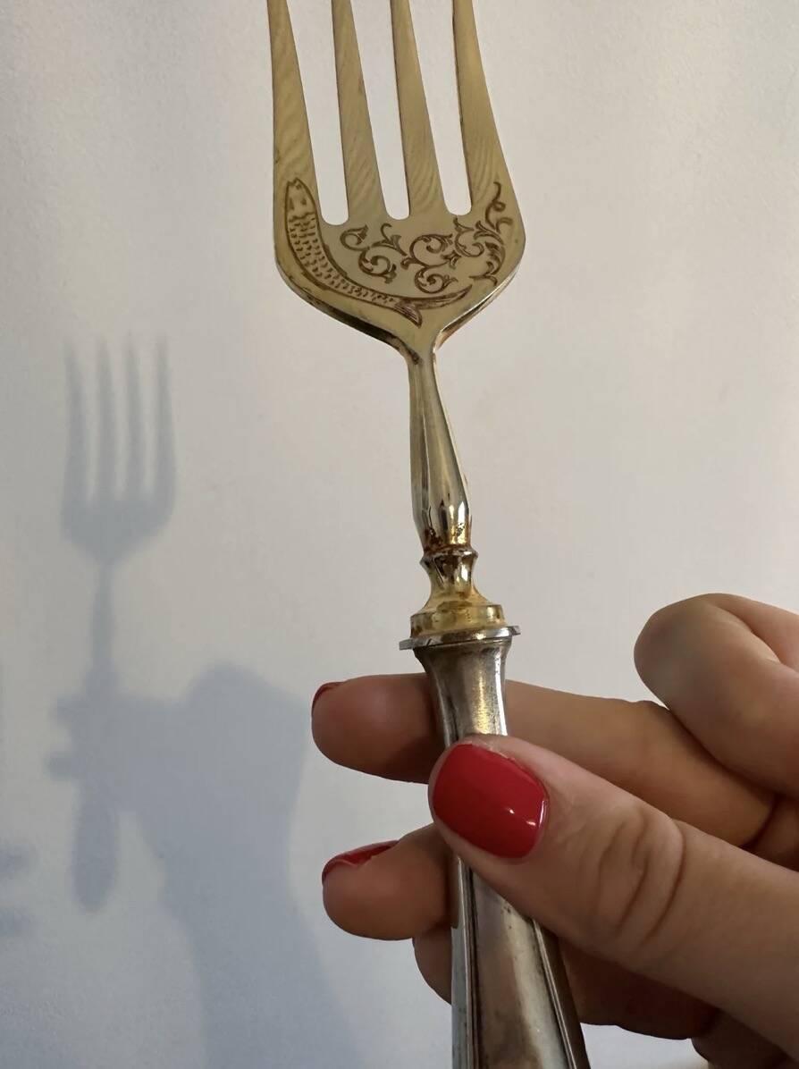 Engraved meat fork in silver and gold metal