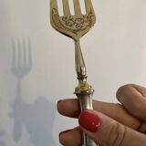 Engraved meat fork in silver and gold metal
