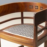 Central European armchair from the early 20th century with an inlaid backrest.