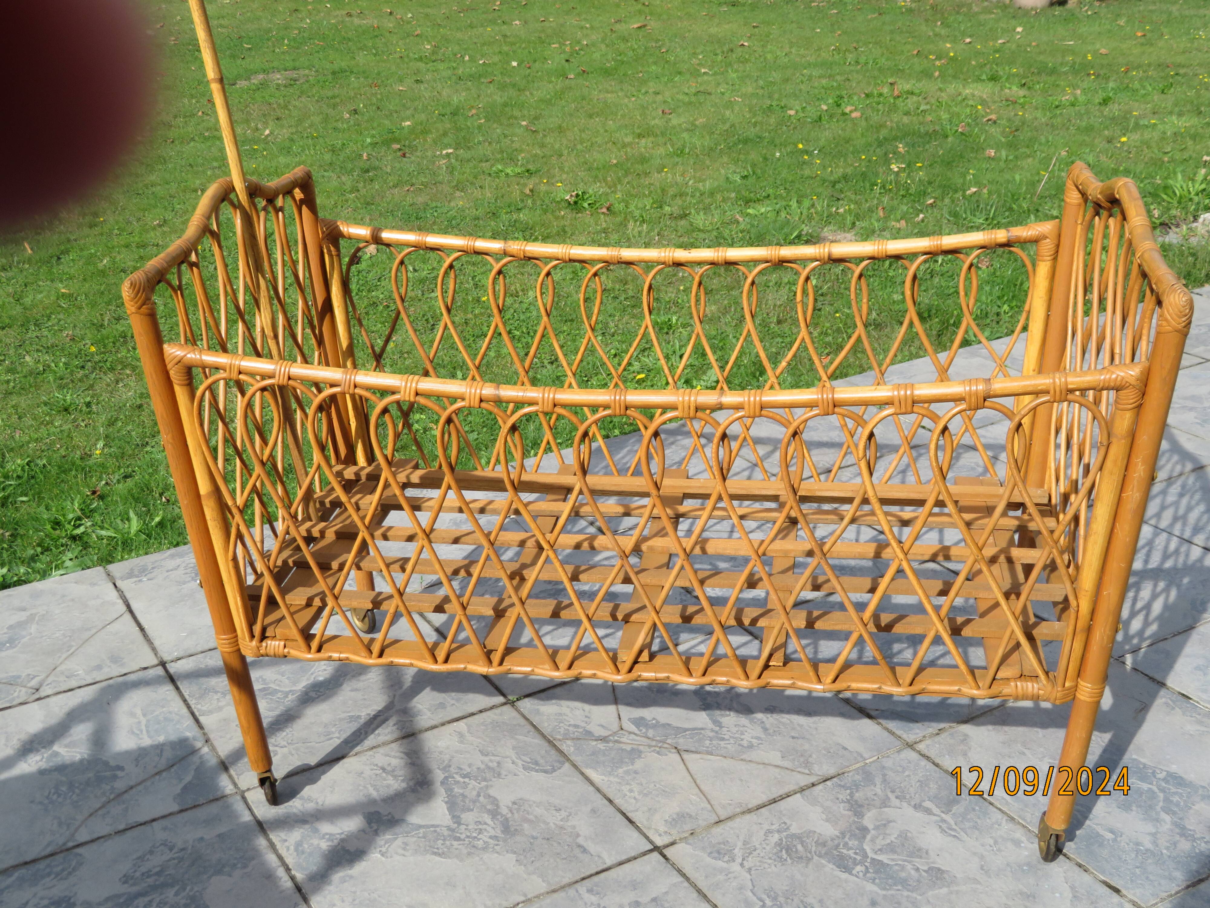 antique rattan children's bed with arrow