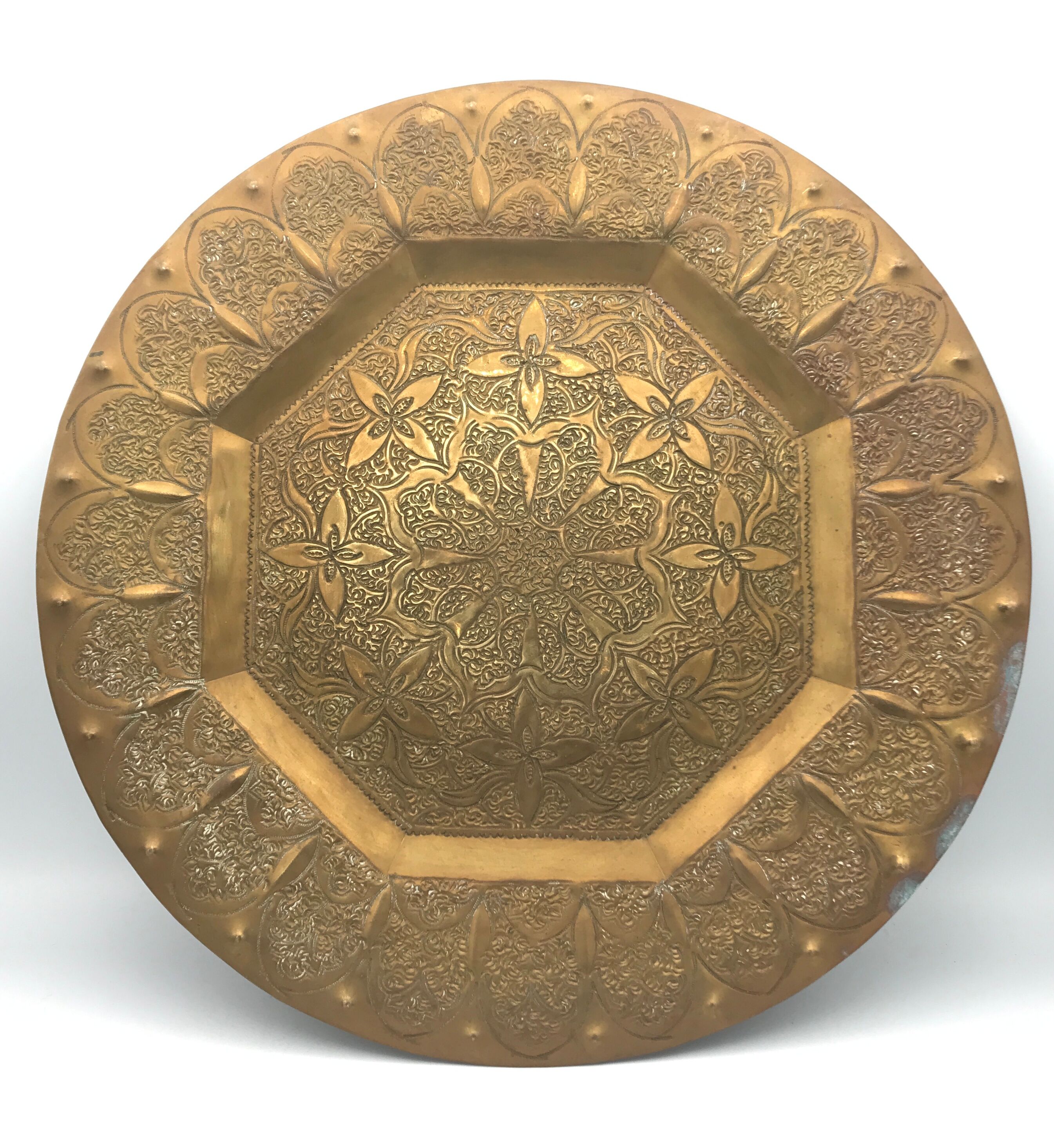 Oriental brass tray with chiseled decoration of arabesques and flowers