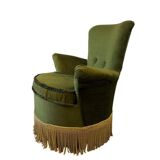 Vintage moss green cocktail chair with fringes.
