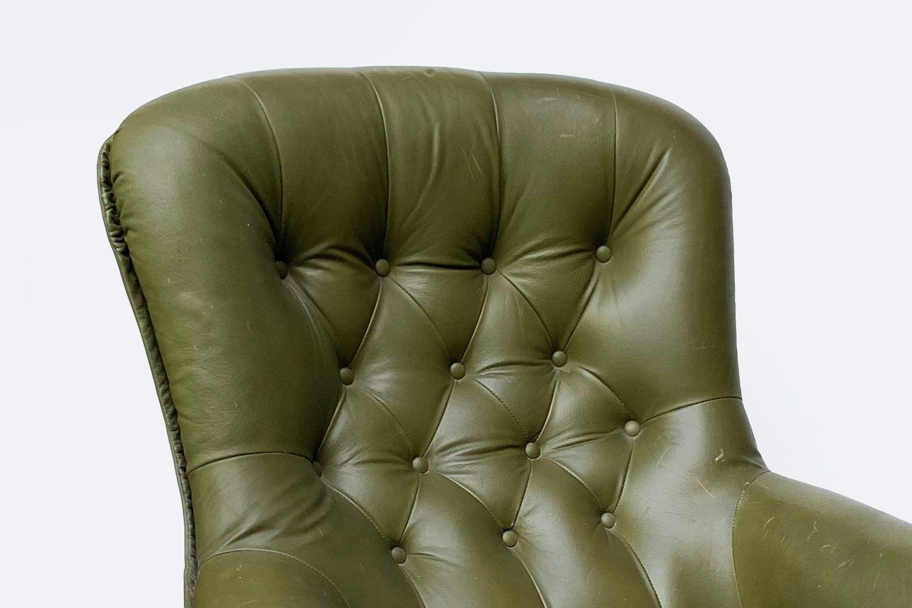 Swivel armchair in olive green leather 1970s