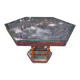 Handcrafted hexagonal wooden table with natural decor.