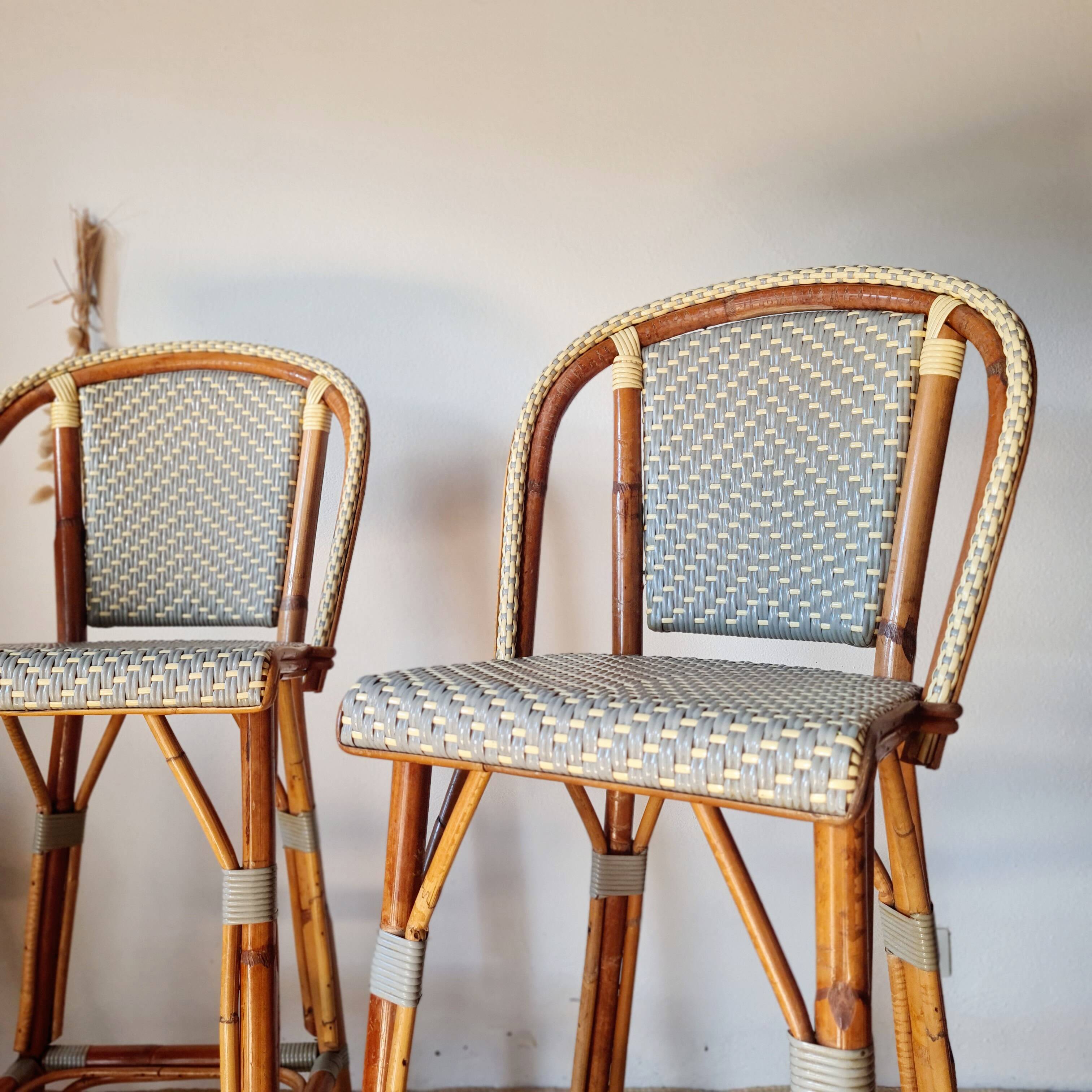 Pair of vintage Gatti bar stools in two-tone rattan and caning.