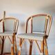 Pair of vintage Gatti bar stools in two-tone rattan and caning.