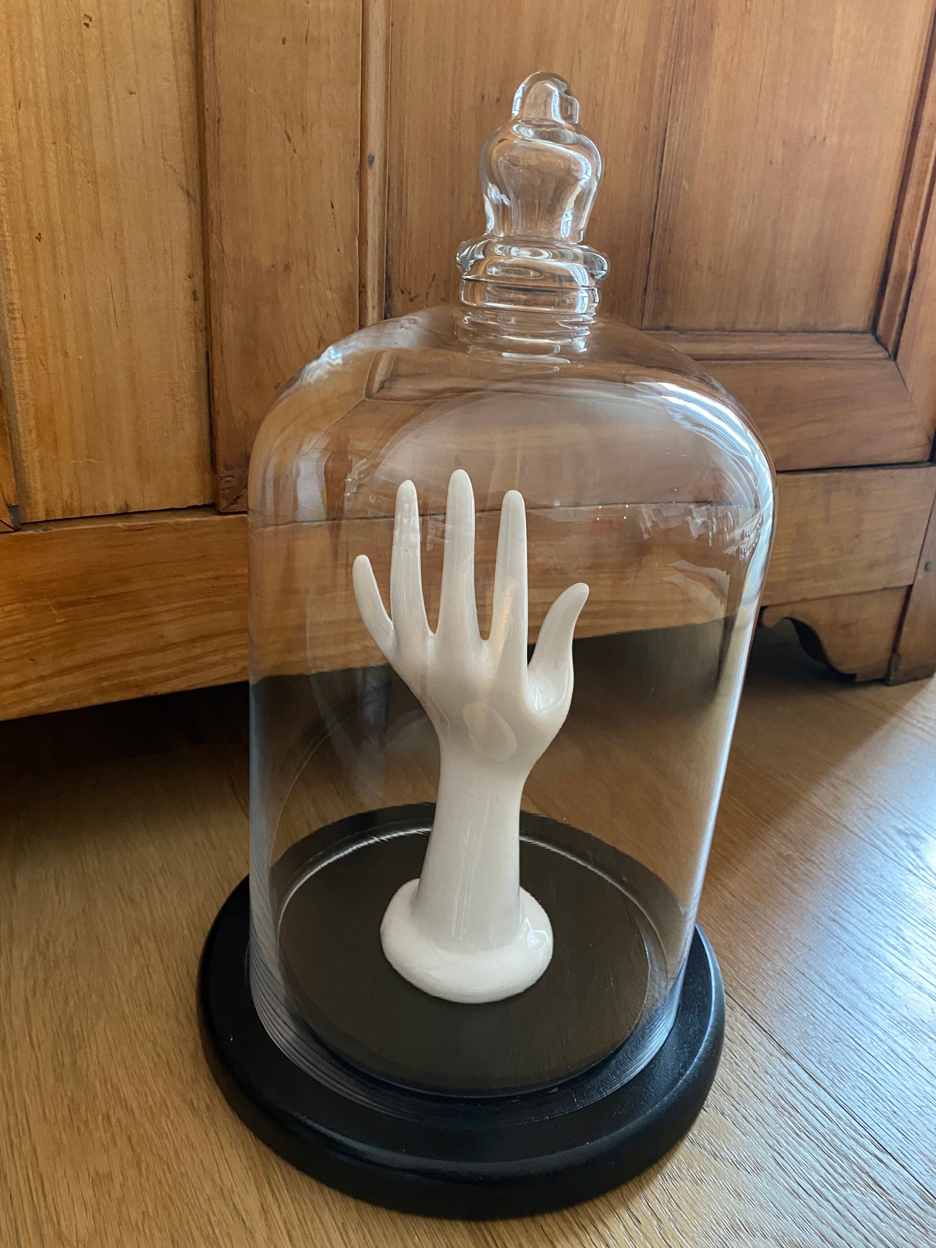 Large old glass bell and its wooden base