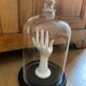 Large old glass bell and its wooden base